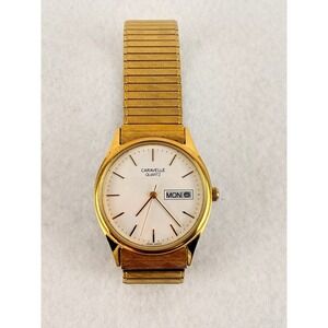 Vintage 1991 Caravelle by Bulova Gold Tone Day Date Quartz Watch 33mm T1 WORKS